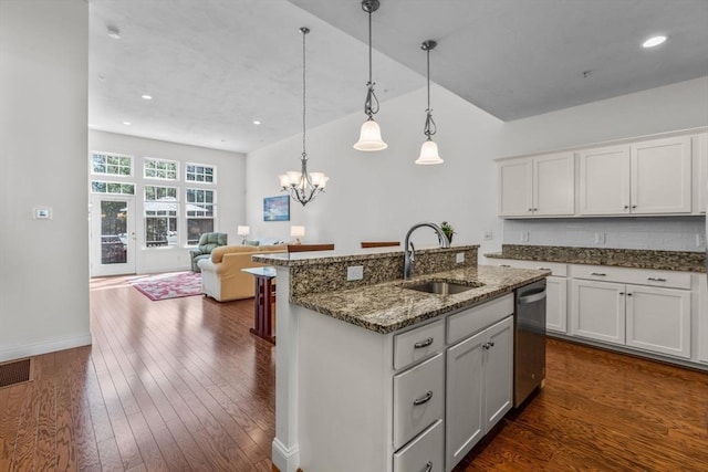22 Grey Hawk Dr Unit 22, Mashpee, MA 02649 - kitchen with a sink, dark stone counters, dishwasher, and dark wood finished floors