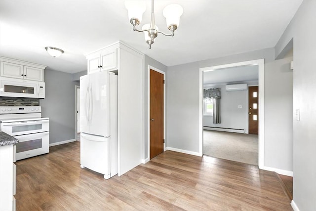25 Saybrook Cir, South Hadley, MA 01075 - kitchen with white appliances, a wall mounted air conditioner, a baseboard heating unit, a chandelier, and white cabinetry