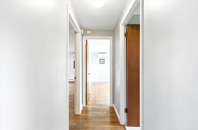 25 Saybrook Cir, South Hadley, MA 01075 - corridor with wood finished floors, baseboards, and a wall unit AC