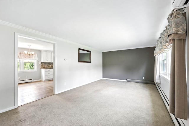 25 Saybrook Cir, South Hadley, MA 01075 - empty room with a baseboard radiator, light carpet, crown molding, baseboards, and a chandelier