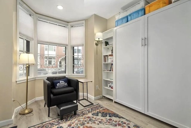 sitting room with light hardwood / wood-style floors