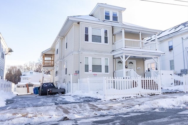 view of front of house featuring a balcony