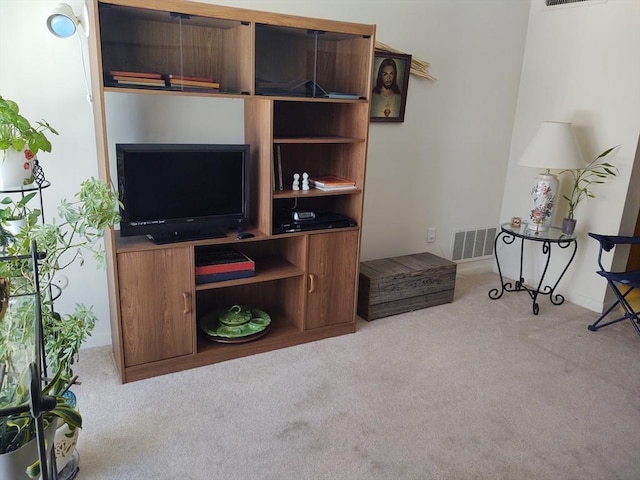 living room featuring carpet flooring and visible vents