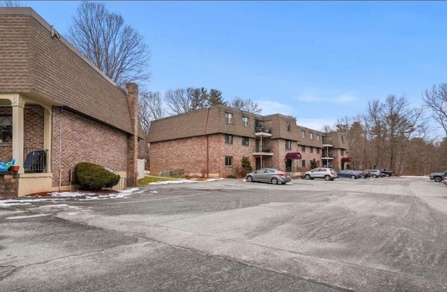 view of property with uncovered parking