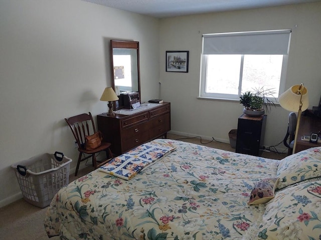 bedroom featuring multiple windows and baseboards