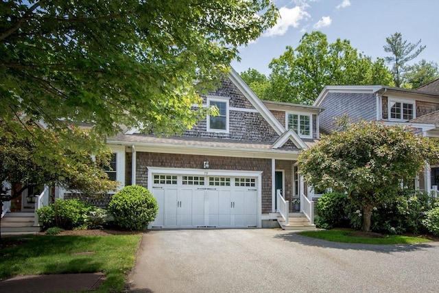 79 Spring Meadow Ln Unit 79, Hanover, MA 02339 - view of front of house with asphalt driveway and a garage