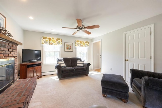 67 Jacap Dr, North Attleboro, MA 02760 - living area featuring a baseboard radiator, light carpet, a fireplace, ceiling fan, and baseboards
