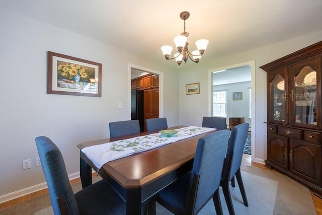 67 Jacap Dr, North Attleboro, MA 02760 - dining space with a chandelier, wood finished floors, and baseboards