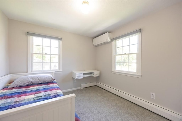 67 Jacap Dr, North Attleboro, MA 02760 - bedroom featuring a wall unit AC, a baseboard heating unit, and carpet floors