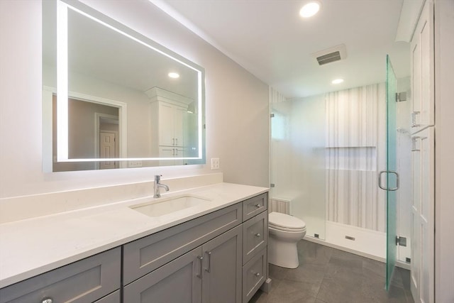 67 Jacap Dr, North Attleboro, MA 02760 - bathroom featuring toilet, vanity, a stall shower, recessed lighting, and tile patterned floors
