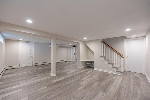 67 Jacap Dr, North Attleboro, MA 02760 - finished below grade area featuring light wood-type flooring, a baseboard radiator, recessed lighting, stairway, and baseboards