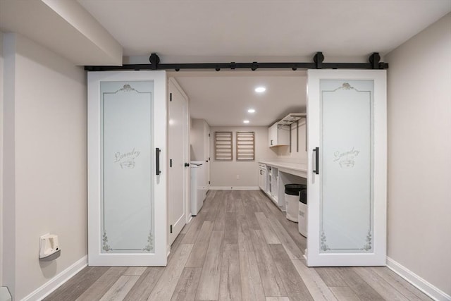 67 Jacap Dr, North Attleboro, MA 02760 - corridor with a barn door, light wood-style floors, recessed lighting, and baseboards