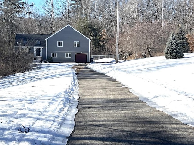 exterior space with driveway and an attached garage