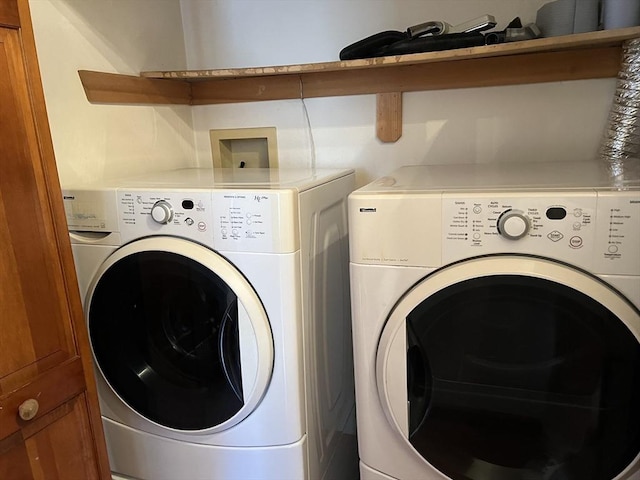 washroom with laundry area and washer and clothes dryer