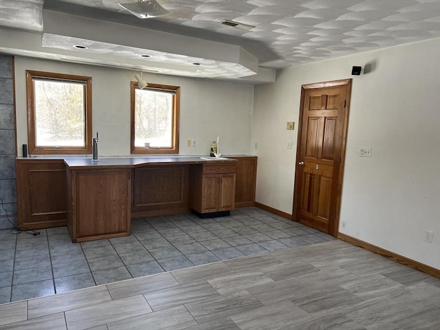 interior space featuring baseboards