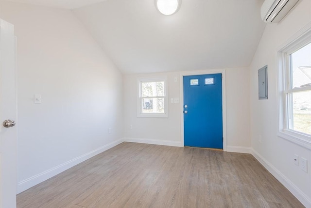 9 Bells Neck Rd Unit 4, Harwich, MA 02671 - entryway with lofted ceiling, light wood finished floors, a wall mounted air conditioner, and electric panel