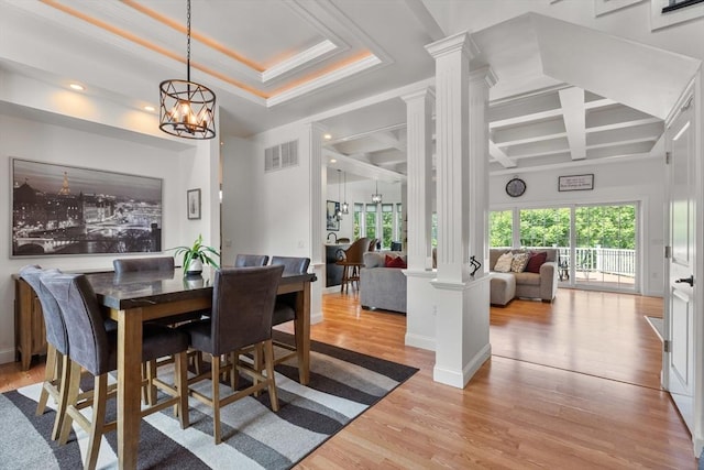31 Cedar St, North Reading, MA 01864 - dining space featuring ornate columns, coffered ceiling, light wood-style floors, a chandelier, and recessed lighting