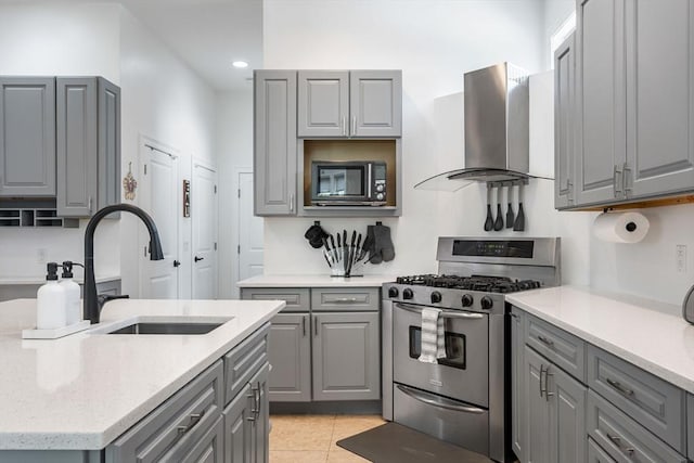 31 Cedar St, North Reading, MA 01864 - kitchen featuring gray cabinets, gas range, wall chimney range hood, and recessed lighting