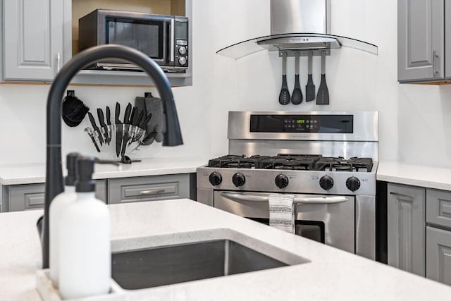 31 Cedar St, North Reading, MA 01864 - kitchen featuring stainless steel appliances, gray cabinetry, and extractor fan