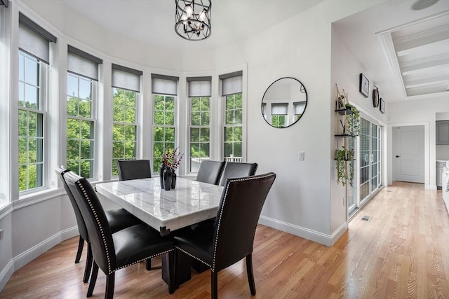 31 Cedar St, North Reading, MA 01864 - dining room with light wood-style floors and a chandelier