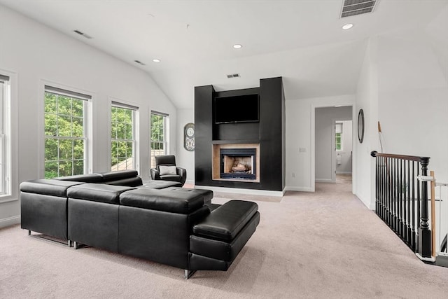 31 Cedar St, North Reading, MA 01864 - living area with light colored carpet, a fireplace, recessed lighting, and lofted ceiling