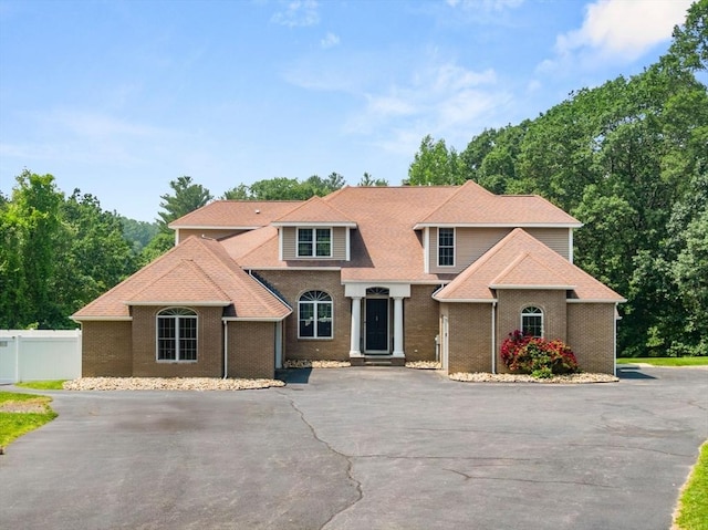 31 Cedar St, North Reading, MA 01864 - traditional home with brick siding and asphalt driveway