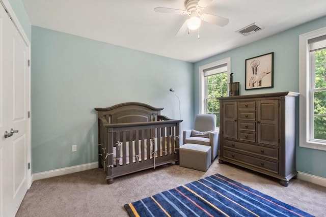 31 Cedar St, North Reading, MA 01864 - bedroom featuring carpet floors, a ceiling fan, and a crib