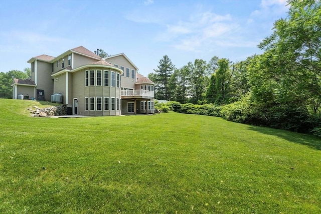 31 Cedar St, North Reading, MA 01864 - rear view of house with a yard and a wooden deck