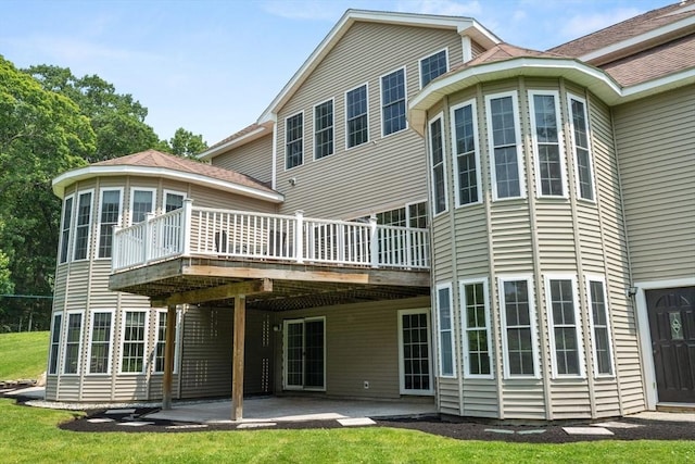 31 Cedar St, North Reading, MA 01864 - rear view of property with a wooden deck, a lawn, a carport, and a patio area