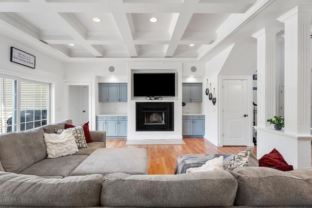 31 Cedar St, North Reading, MA 01864 - living room with light wood-type flooring, beam ceiling, coffered ceiling, a glass covered fireplace, and recessed lighting