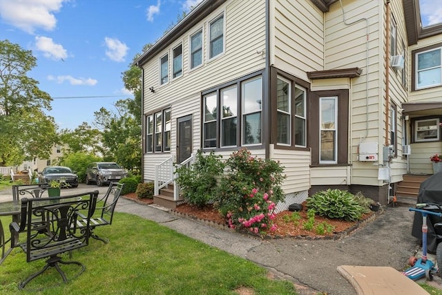 27-1/2 7th Ave, Haverhill, MA 01830 - view of side of property with entry steps and a lawn