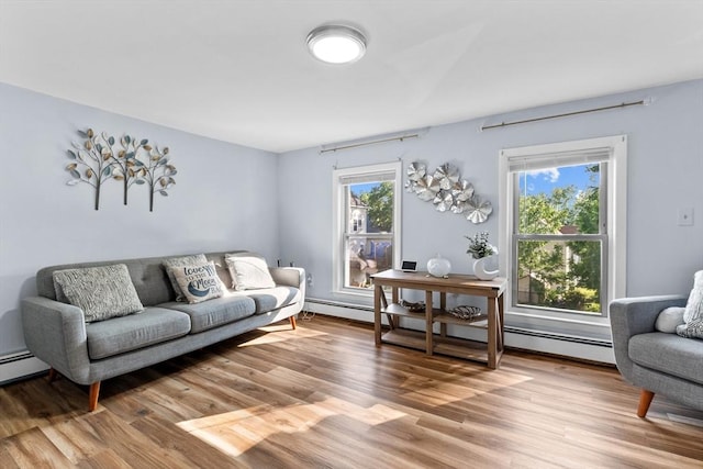 27-1/2 7th Ave, Haverhill, MA 01830 - living room with a baseboard heating unit, light wood-style flooring, and healthy amount of natural light