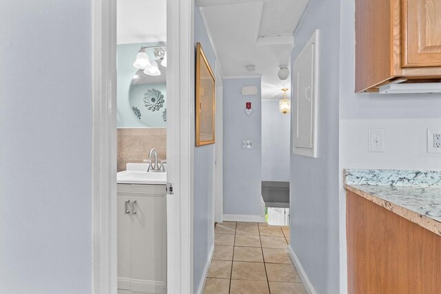 27-1/2 7th Ave, Haverhill, MA 01830 - corridor featuring a sink and light tile patterned floors