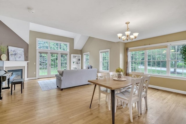 1 Chase Path Unit 1, Acton, MA 01720 - dining space with baseboards, a chandelier, plenty of natural light, light wood-type flooring, and lofted ceiling