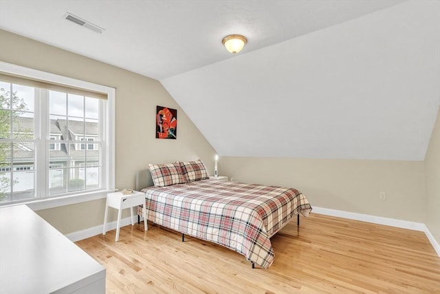 1 Chase Path Unit 1, Acton, MA 01720 - bedroom featuring baseboards, vaulted ceiling, and light wood-type flooring