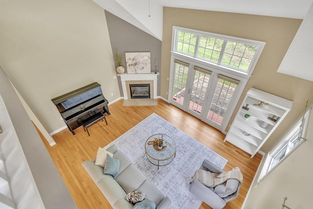1 Chase Path Unit 1, Acton, MA 01720 - living area with high vaulted ceiling, a high end fireplace, wood finished floors, and baseboards