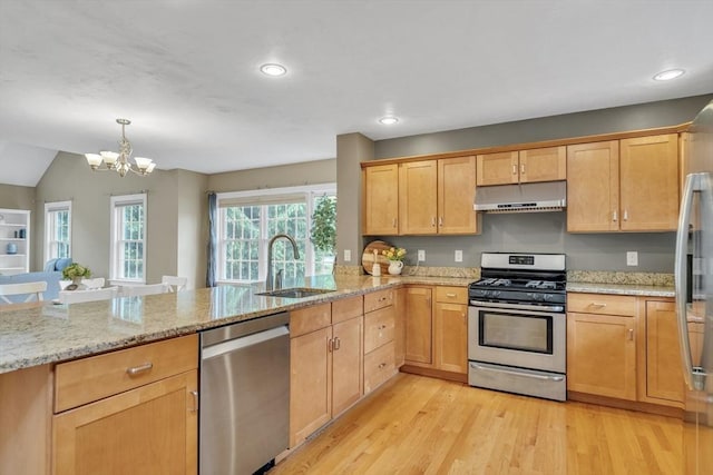 1 Chase Path Unit 1, Acton, MA 01720 - kitchen with stainless steel appliances, under cabinet range hood, a sink, a peninsula, and a chandelier
