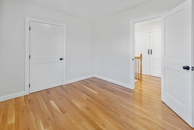 spare room featuring light hardwood / wood-style floors