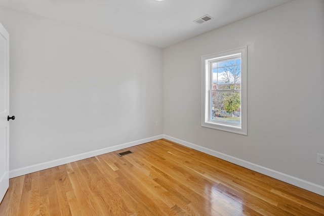 unfurnished room with light hardwood / wood-style floors