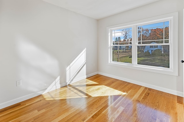 spare room with hardwood / wood-style floors