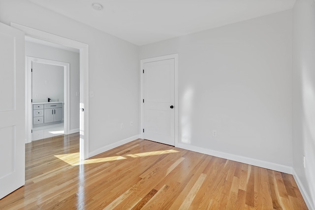 unfurnished room with hardwood / wood-style floors