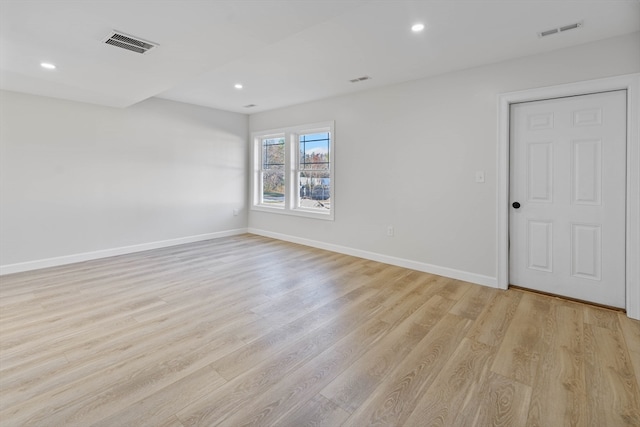 spare room with light hardwood / wood-style floors