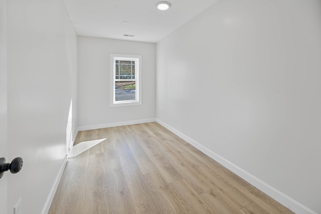 spare room with light wood-type flooring