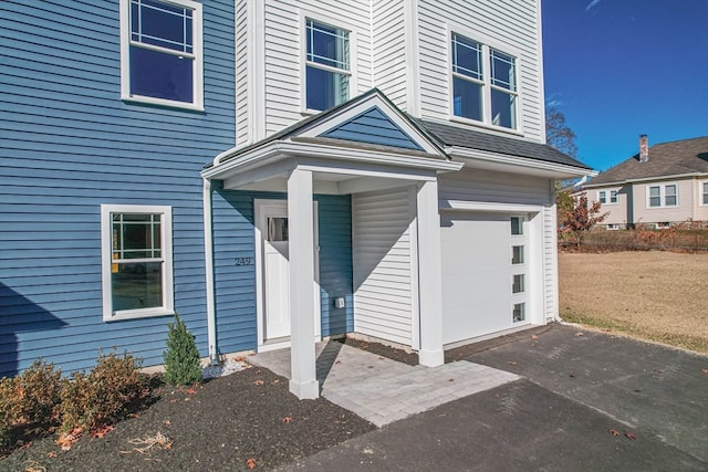 property entrance featuring a garage