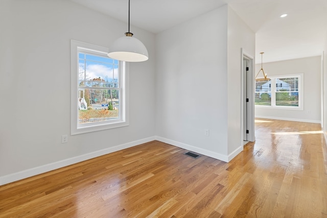 unfurnished dining area with light hardwood / wood-style flooring