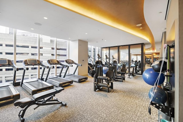 workout area featuring recessed lighting and floor to ceiling windows