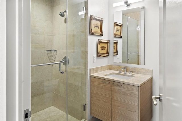 bathroom with vanity and a stall shower