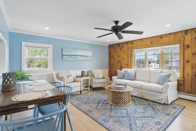 129 Northern Blvd, Newbury, MA 01951 - living room featuring a baseboard radiator, recessed lighting, ornamental molding, a ceiling fan, and light wood-style floors