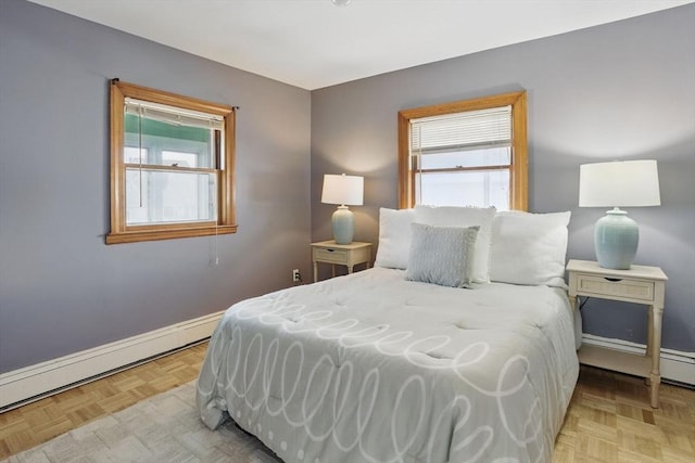 129 Northern Blvd, Newbury, MA 01951 - bedroom with multiple windows, baseboards, and a baseboard heating unit