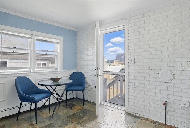 129 Northern Blvd, Newbury, MA 01951 - living area featuring brick wall, stone tile floors, crown molding, and baseboard heating